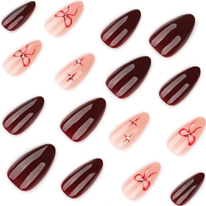 Elegant burgundy and pink almond press-on nails with ribbon bow and rhinestone accents