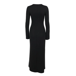 Rear view of sleek black long-sleeve split maxi dress with form-fitting silhouette