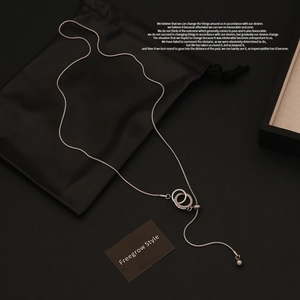 Detailed view of silver heart pendant with adjustable snake chain and sliding buckle