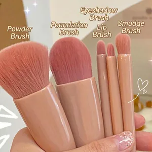 Travel 5pcs makeup brush set with pink handle and soft bristles in hand view