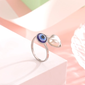 Polished stainless steel adjustable ring with blue evil eye and heart pearl charm