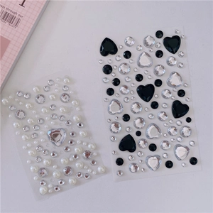 Detail of heart and round crystal gem stickers for DIY girl crafts and decorations