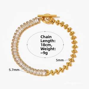 Detail view of gold cuban chain with square zircon stones and OT toggle clasp closure