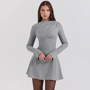 Detail of grey slim-fit long sleeve mini dress featuring ruched shoulder and high neckline