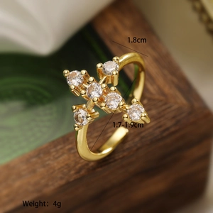 Macro detail of gold-plated geometric ring with zircon cross design and 1.8cm ornament