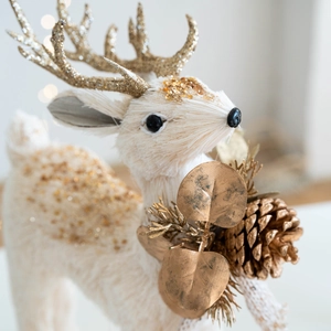 Elegant white faux fur Christmas reindeer ornament with gold glitter and pine cone accents
