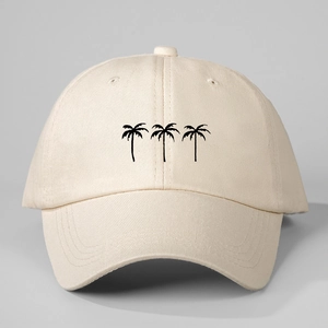 Close-up of three black palm tree embroidery on a beige cotton baseball sun hat