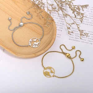 Detail of adjustable hollow world map pendant bracelet in gold and silver finish