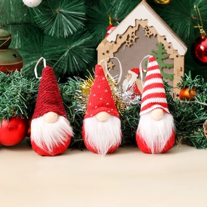 Three Christmas gnomes set with knitted hats and plush beards for tree decoration