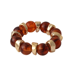 Retro geometric amber acrylic bead bracelet with polished gold metal spacers on white background