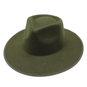 Detail of dark olive wool fedora showing the stiff brim and reinforced stitched edge