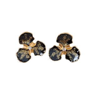 Boucles d'oreilles vintage fleurs en émail noir avec accents dorés et cristal brillant