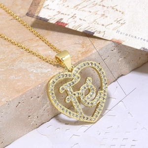 Macro shot of 18k gold plated heart pendant with zircon stones, sized 23mm by 19mm