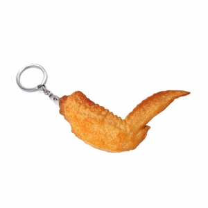 Realistic roasted chicken wing keychain with golden brown texture on silver metal ring