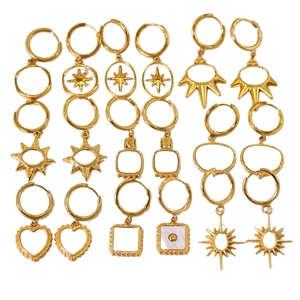 French vintage 14K gold plated earrings collection with white shell charms on white background