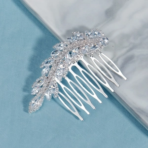 Macro detail of bridal hair comb with shimmering marquise-cut cubic zirconia and silver teeth