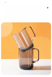 Detail of translucent brown mouthwash cup with curved rim and ergonomic handle design