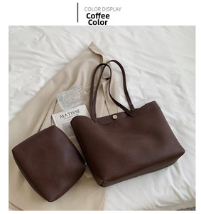 Detail of coffee brown litchi pattern leather tote bag with matching zipper pouch