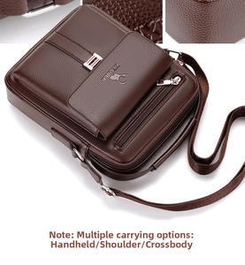 Detail of dark brown leather crossbody bag with logo embossing and silver zippers