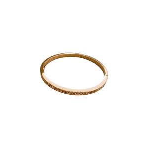 Elegant rose gold geometric hinged bangle featuring a pavé set of sparkling cubic zirconia