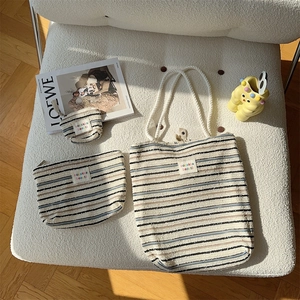 Three-piece striped canvas bag set with large tote, cosmetic pouch and mini wallet