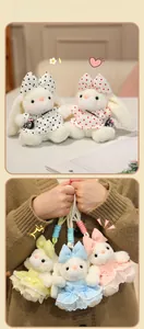 Detail of plush bunny keychains with polka dot dresses and colorful woven lanyards