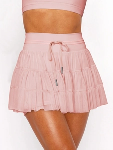 Detail showing pink layered mesh skirt with integrated safety shorts and mesh texture