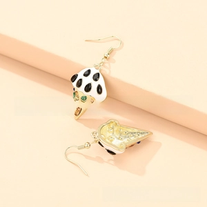 Detail of ice cream cone earrings with colorful rhinestones and white enamel finish