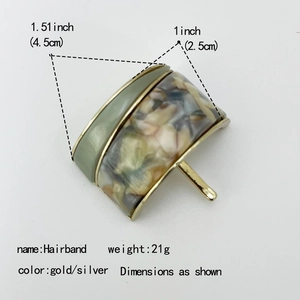 Elegant gold hair clip with green enamel and tortoiseshell resin pattern for ponytail