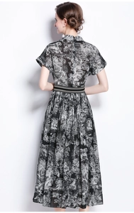 Detail of vintage Toile de Jouy print dress back view with cinched waist design