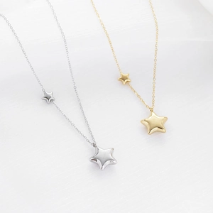 Fashionable stainless steel star pendant necklace in gold and silver finish for women
