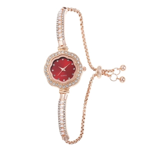 Elegant rose gold women's watch with red dial, pearl bracelet and sparkling crystals