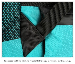 Detail of reinforced cross-stitching on teal ripstop nylon and black mesh hiking pack