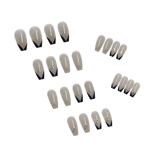 Long ballet press-on nails with grey base, blue V-cut tips, and glitter diamond accents