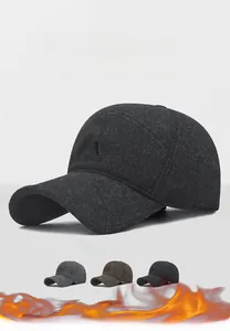 Close-up of winter thermal baseball cap with warm ear flaps and premium fleece fabric