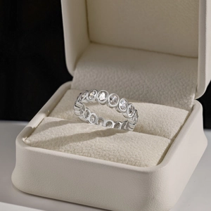 Elegant S925 sterling silver band ring with oval zirconia stones in a luxury gift box