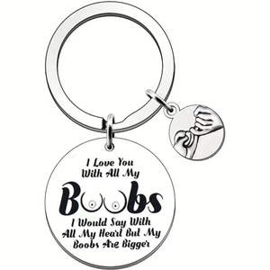 Macro detail of engraved silver stainless steel key ring with humorous round pendants