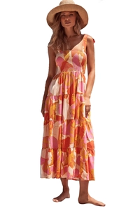 Detail of floral tiered maxi dress featuring elastic smocked bodice and tie straps