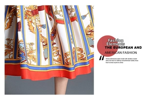 Detailed view of Baroque print short sleeve dress with golden chain and scroll patterns