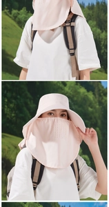 Detail view of pink sun hat with breathable face mask and wide brim for hiking