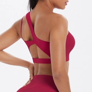 Detail view of one-shoulder sports bra and leggings set with open back cutout