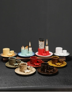 Macro shot of colorful ceramic aromatherapy candle holders with star-shaped accessories