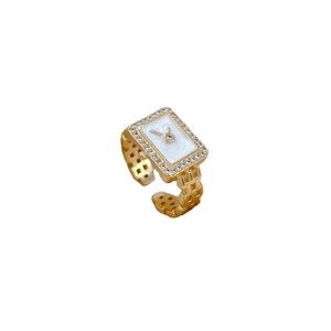 Watch-shaped gold ring with zircon dial and adjustable band in a 45-degree angle view