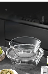 Food-grade transparent glass mixing bowls stacked in a modern kitchen setting