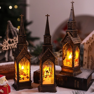 Close-up of three bronze Christmas lanterns with festive LED scenes and warm lighting