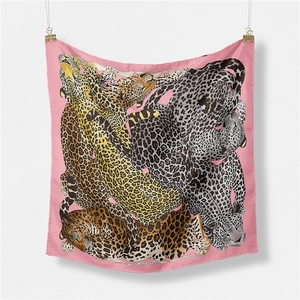Pink silk square scarf featuring a detailed lazy leopardess animal print with Paris text