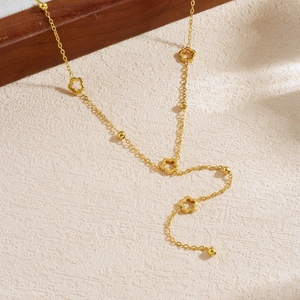 Elegant gold plated stainless steel necklace with hollow flower charms and tassel beads