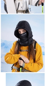 Detail of black winter balaclava hood showing windproof fabric and drawstring closure