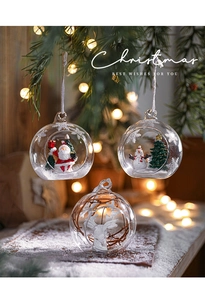 Close-up of glass Christmas ornaments with Santa and reindeer figurines inside