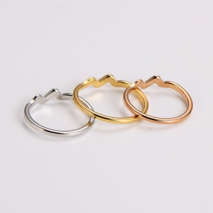Three-piece minimalist wavy stainless steel ring set in silver, gold, and rose gold finishes
